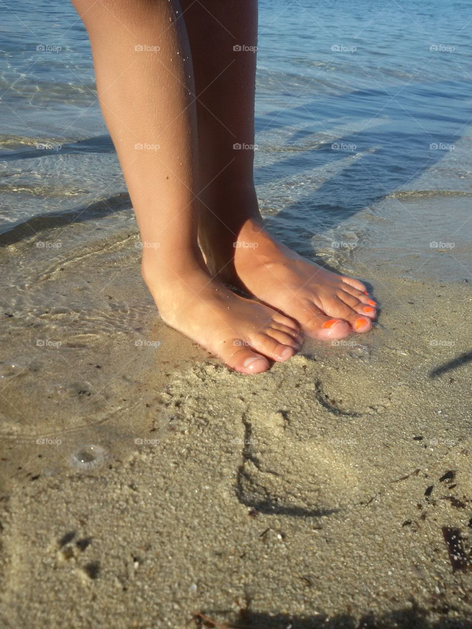 Leg and foot on the beach