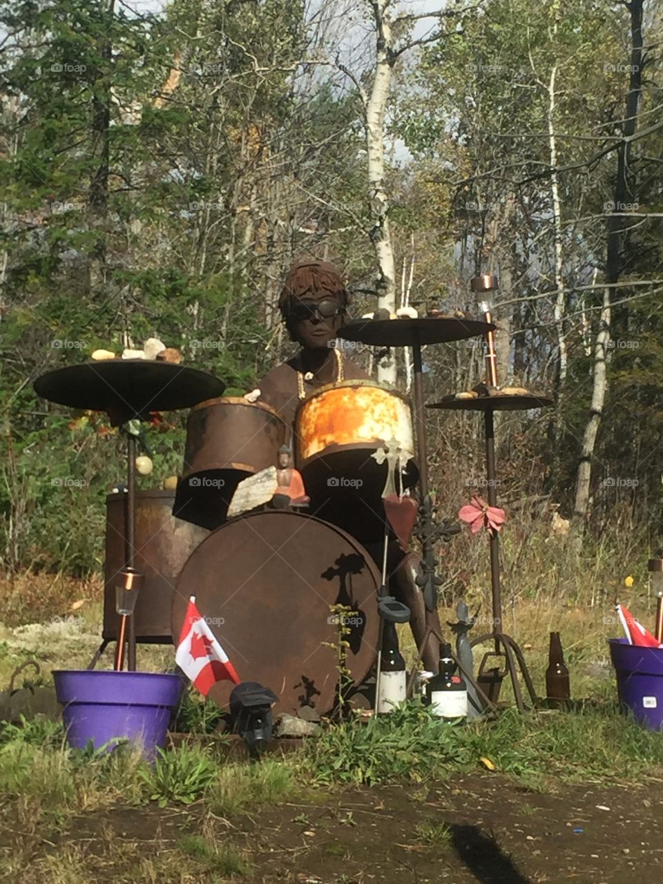 This photo I took of a beautiful monument set on roadside to honour a young man who passed in a car accident it’s made of steel and iron it is an amazing tribute to this boy .This looks so real .