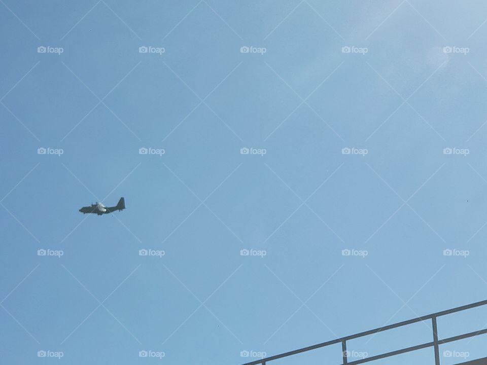 military flying over base