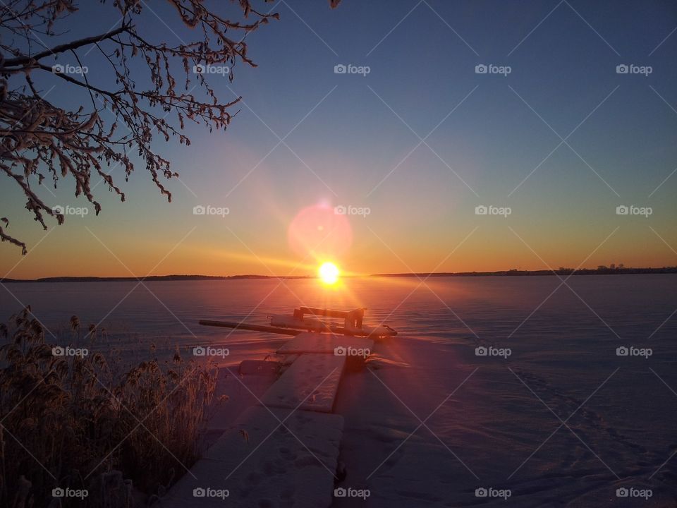 grayness of the day and dim the sun