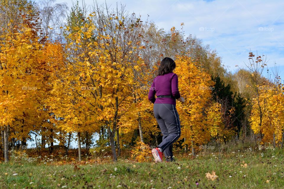 woman running nature landscape