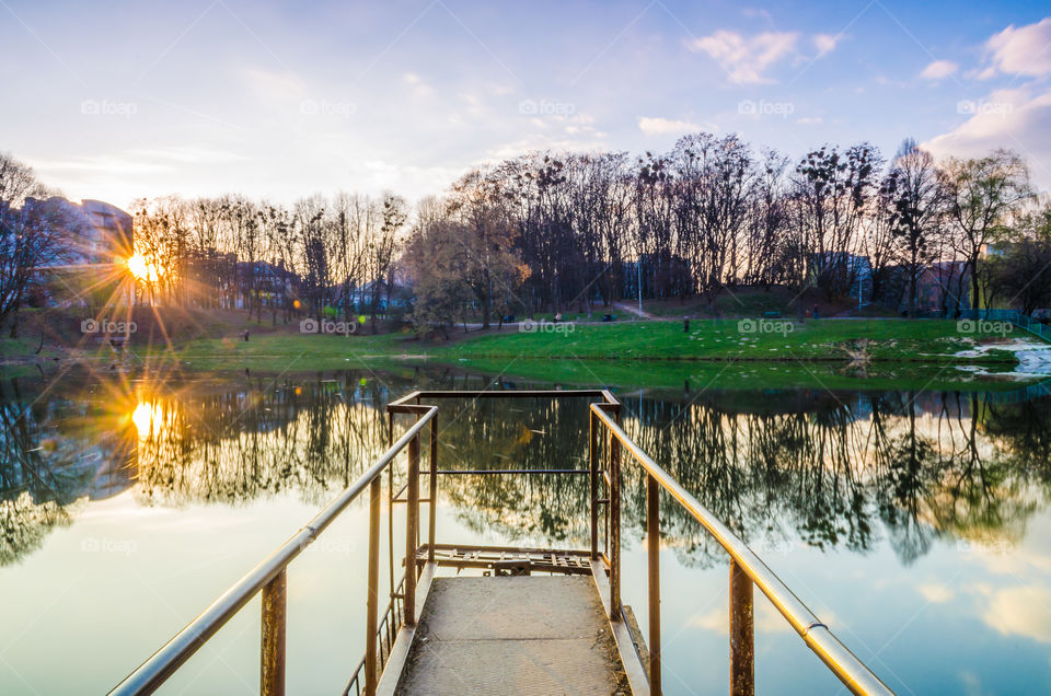 city park with lake in the spring season