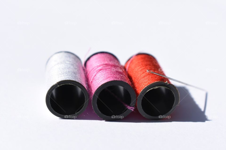 Spools of thread and needle 