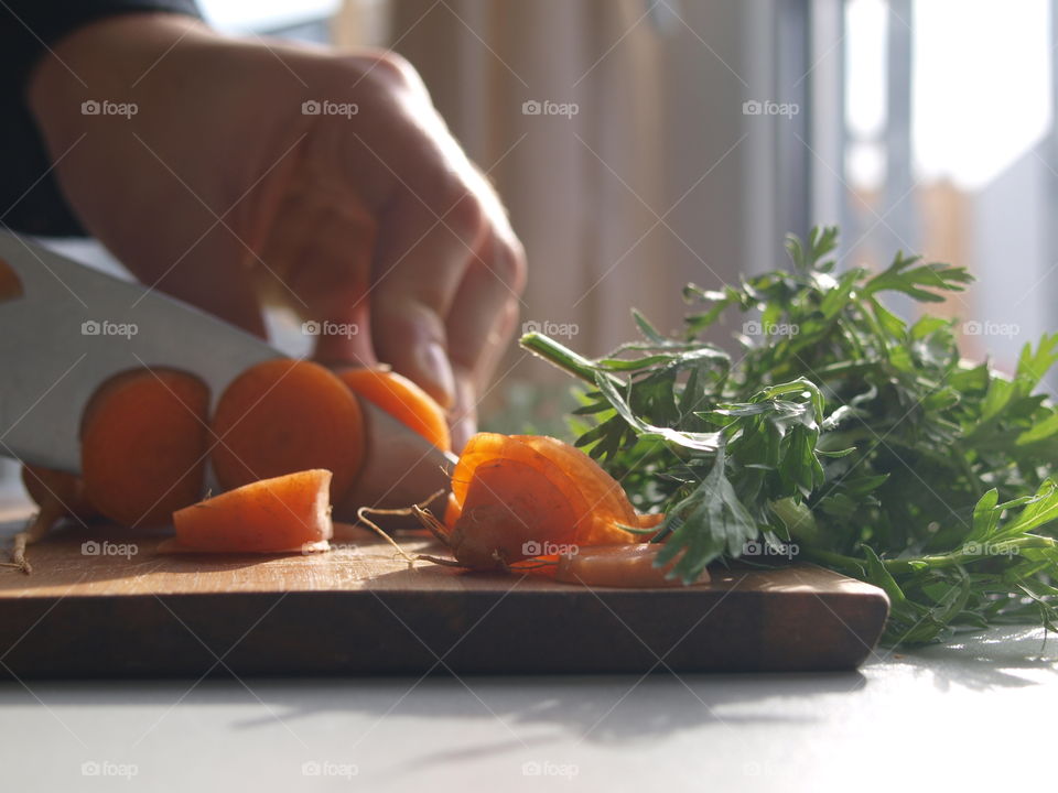 Cutting fresh carrots