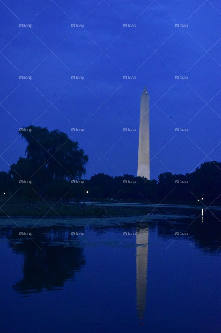 Washington monument at night with reflection