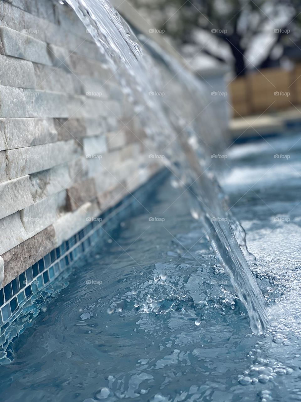 Splashing water from pool waterfall in Texas 