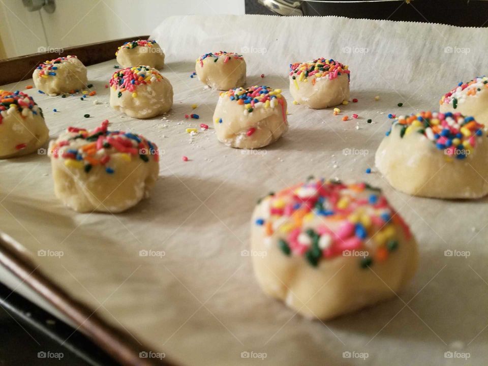 Homemade sugar cookies with sprinkles, ready to go into the oven.