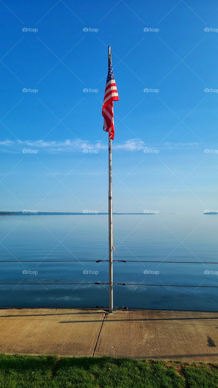 American flash by calm sea