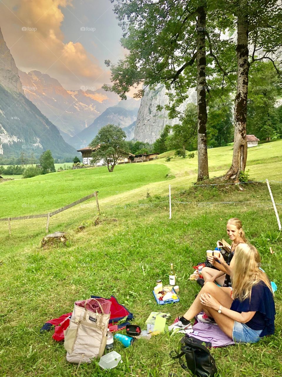 A sunset wine and cheese picnic along a bike path in Lauterbrunnen, Switzerland 