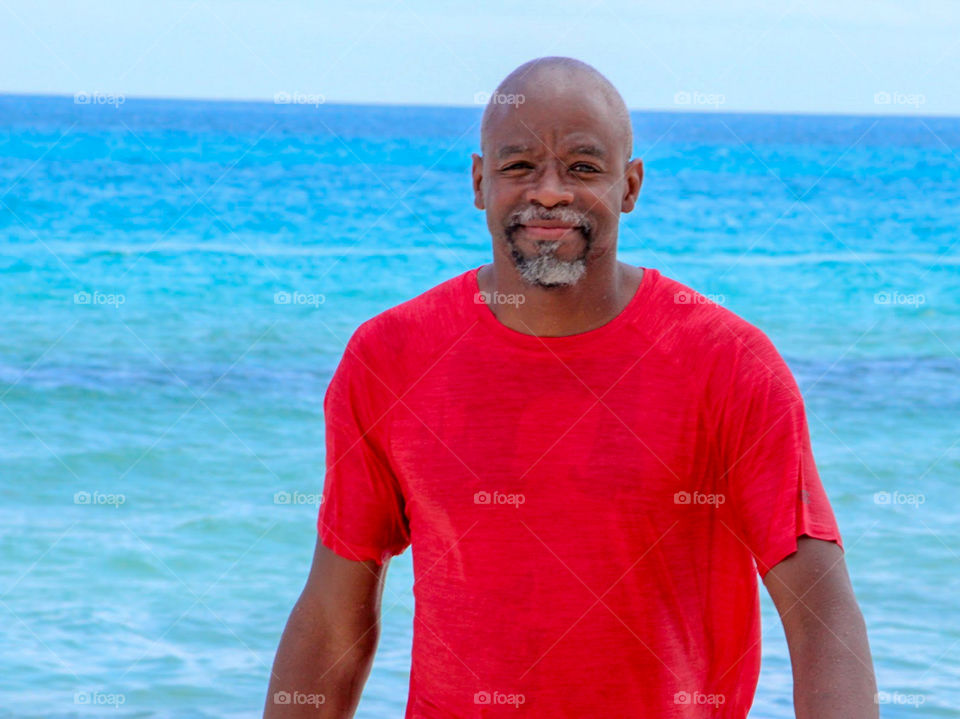 Man smiling at the beach