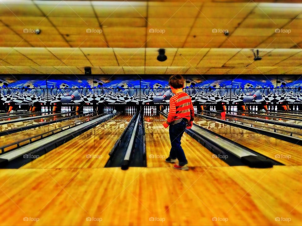 Child in American bowling alley