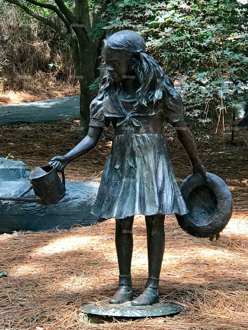 Statue - watering the flowers 