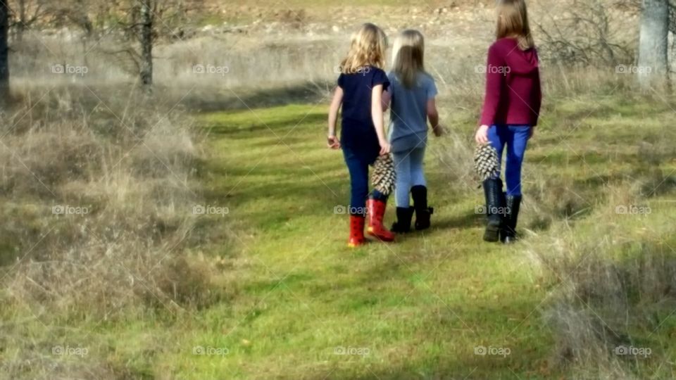 Girls enjoying a walk in their rain boots. Mushy grass and mud is defeated with the right footwear.