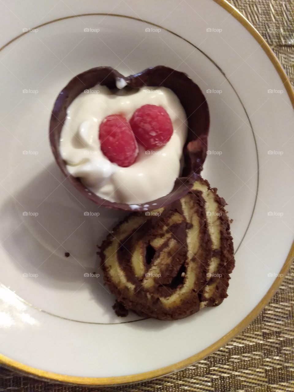 Chocolate cup with raspberry mousse and chocolate