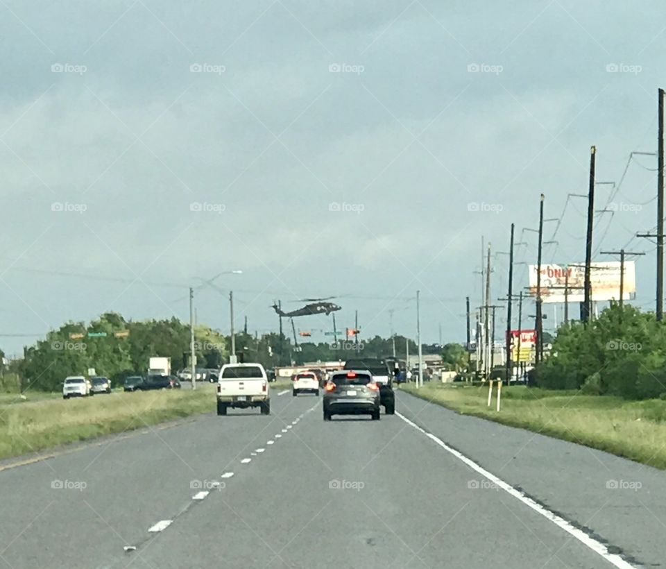 A rescue helicopter lands on the highway in Port Arthur TX in the aftermath of Hurricane Harvey