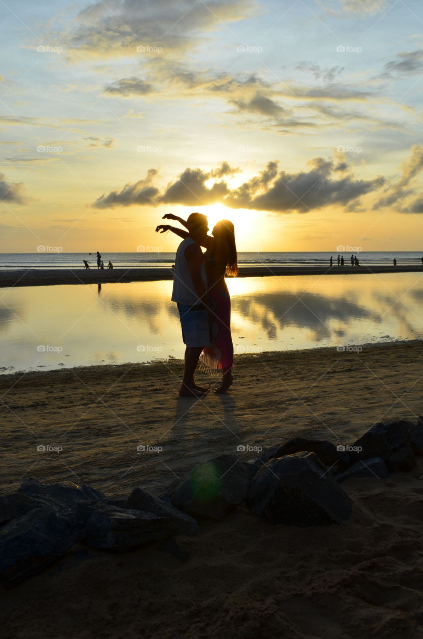 Couple at sunset. Jericoacoara beach  jericoacoara, Brazil 