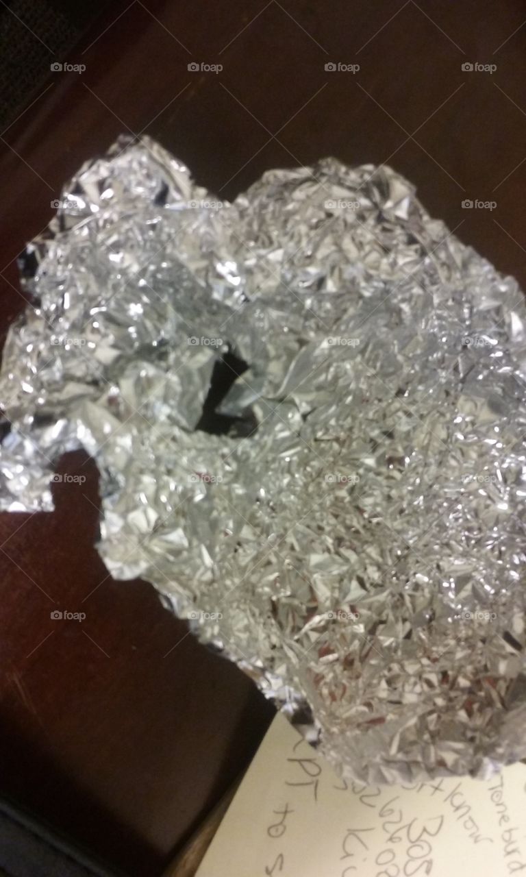 heart shaped hole on aluminum foil paper