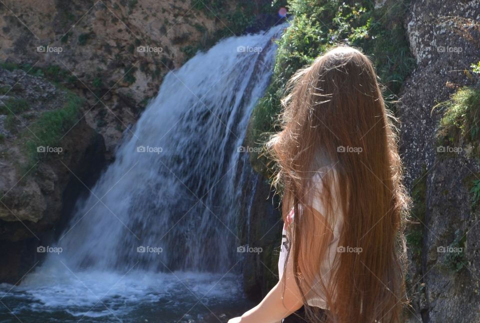 waterfall, long hair, a girl neer a waterfall, nature