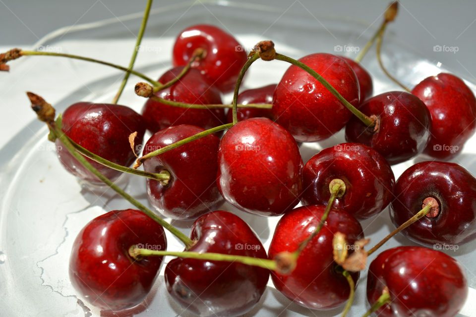 Red cherries on plate