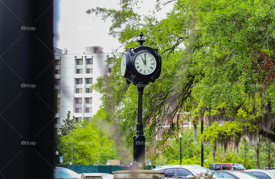 A clock at downtown Miami showing 11am on a beautiful Spring day in Florida. 