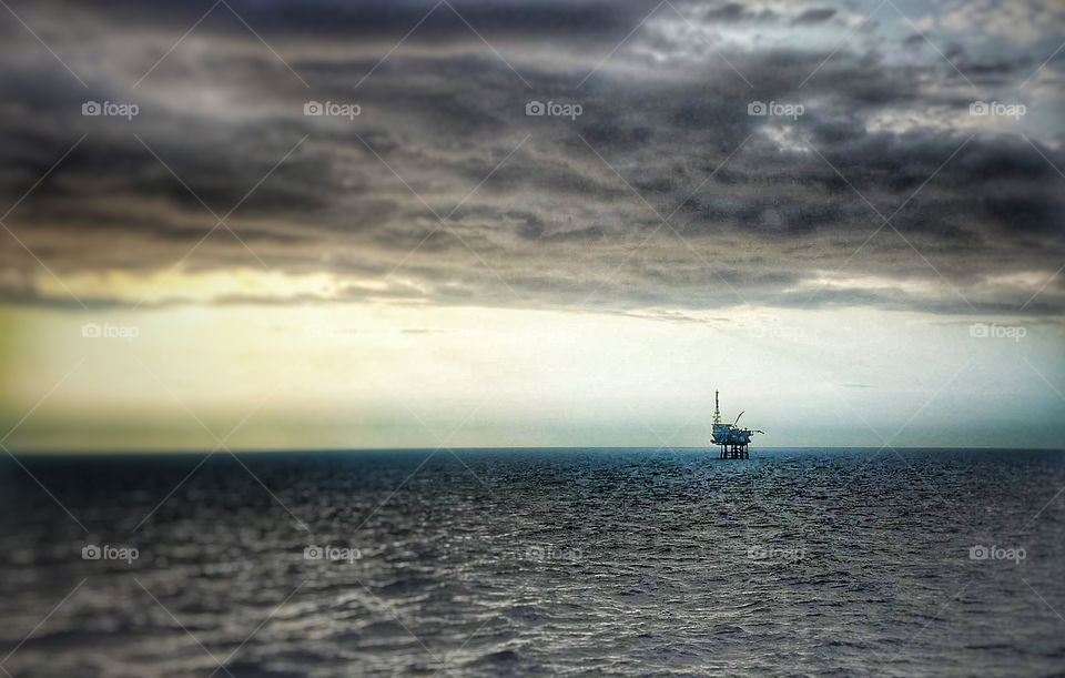 North Sea oil rig on distant horizon 