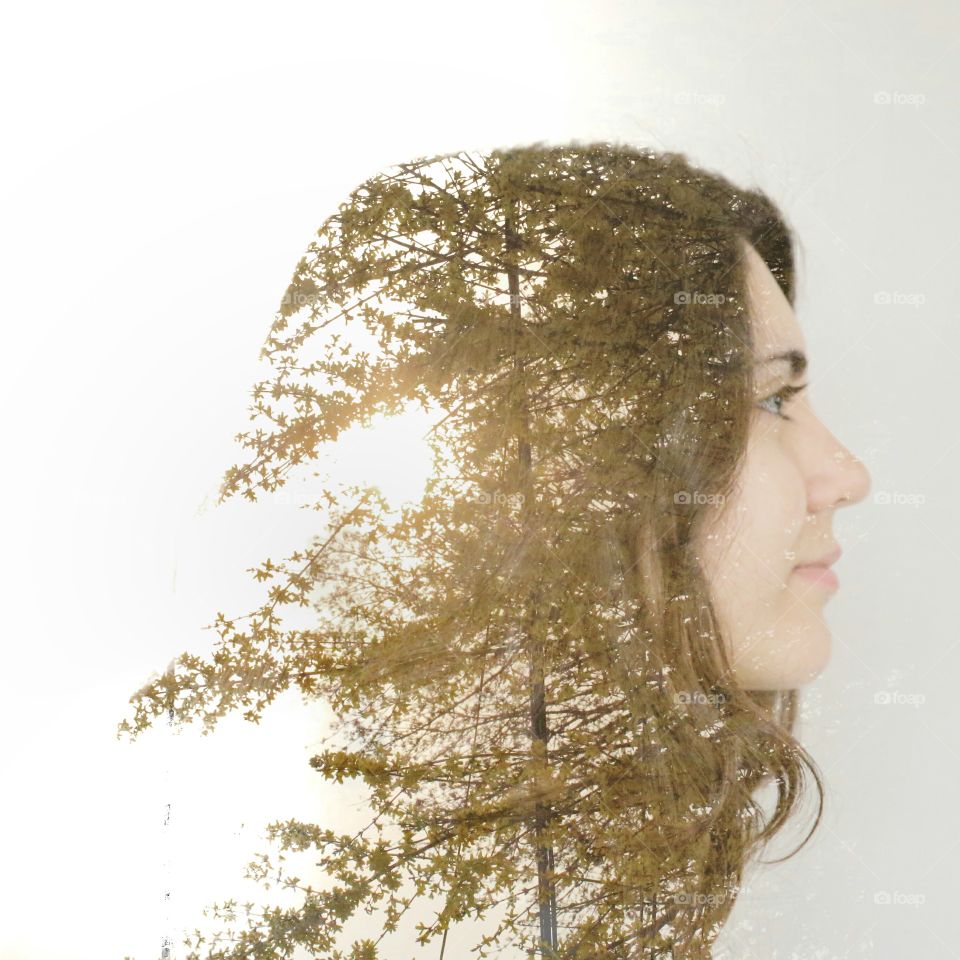 Double exposure. Taken using two photos of my face and trees from my backyard