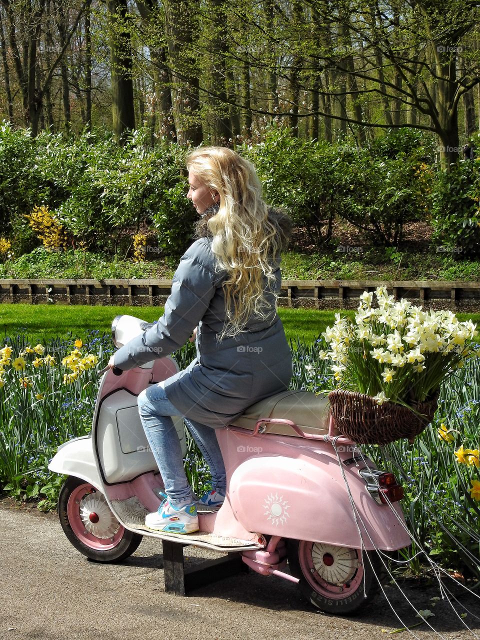 Girl in pink Vespa