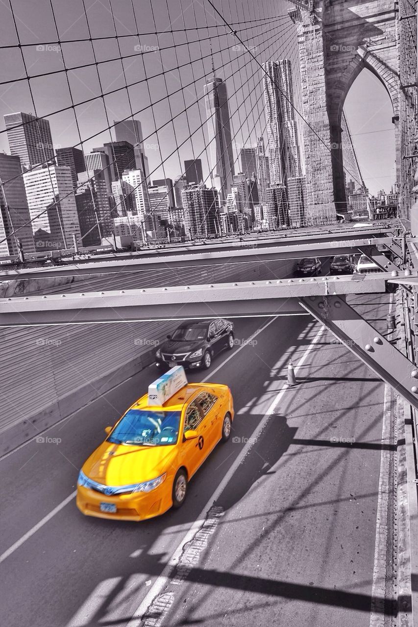 Yellow cab at the Brooklyn bridge