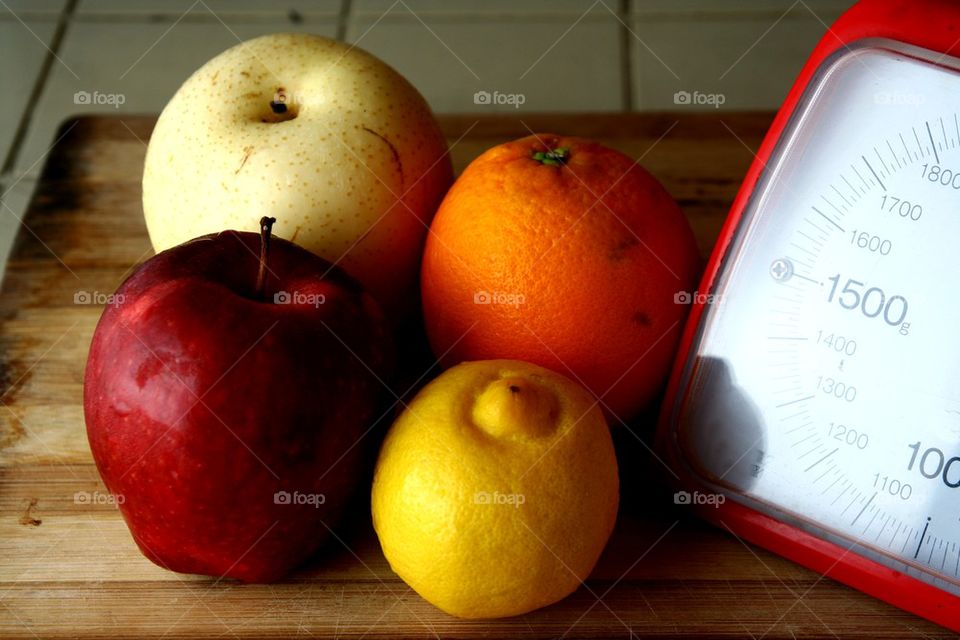 fresh fruits and a weighing scale