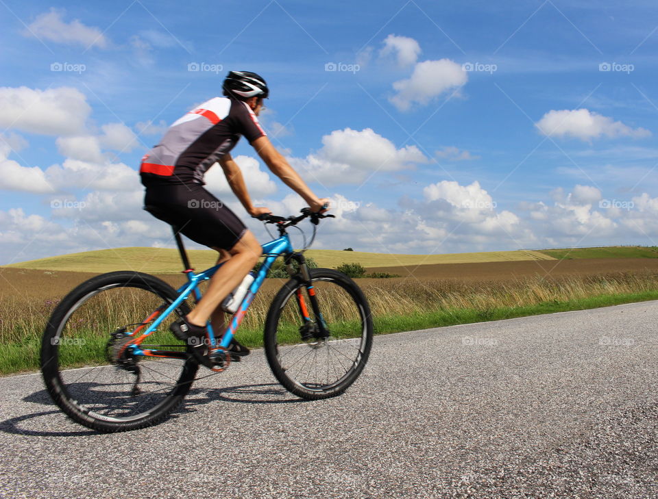 Biking in Skåne landscape, Sweden.