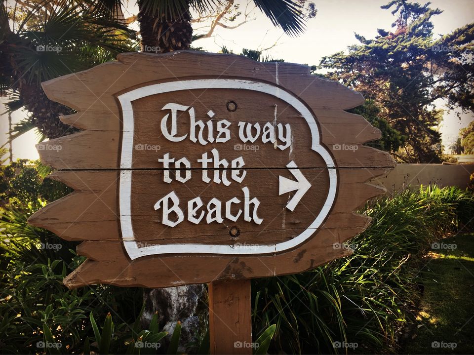 Sign directing visitors towards the beach on the property of Wyndham Garden Ventura Pierpont Inn located in Ventura, CA, circa August 2016