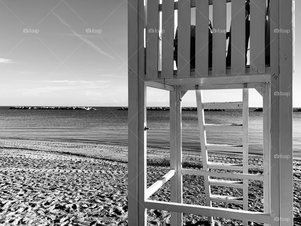 beach of the Adriatic coast at dawn in black and white