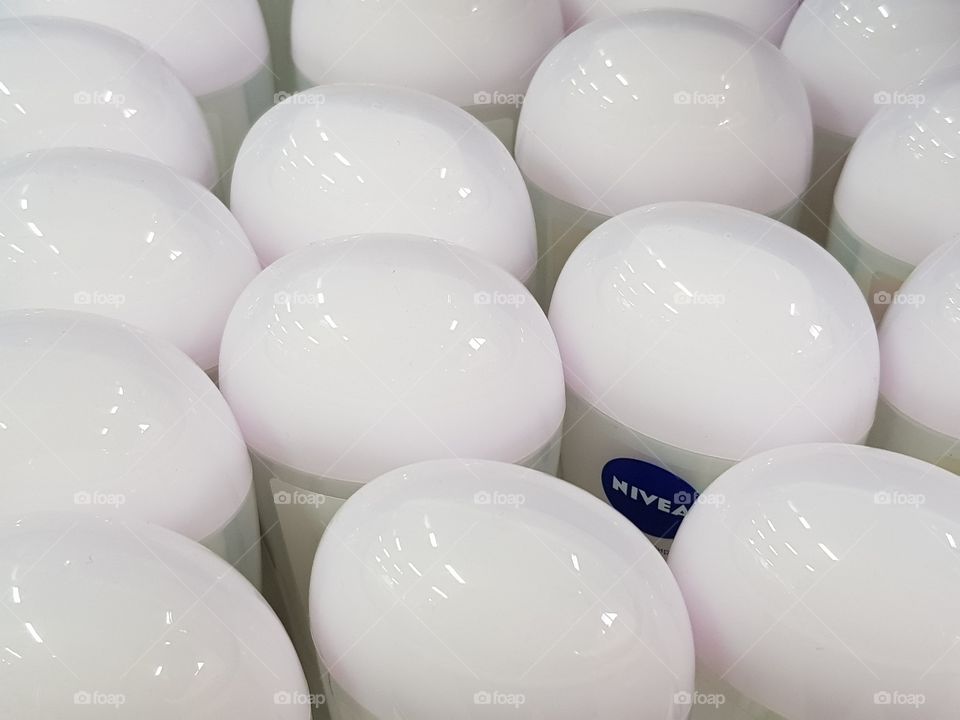 background of white Nivea roll deodorants