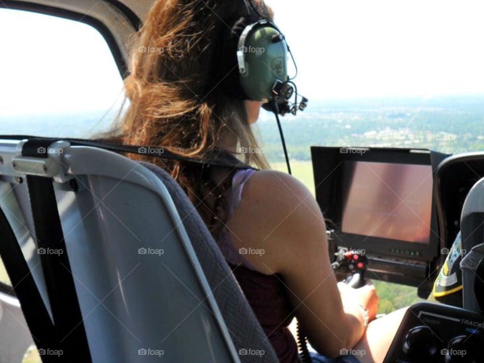 Woman pilot. A woman flying a helicopter 