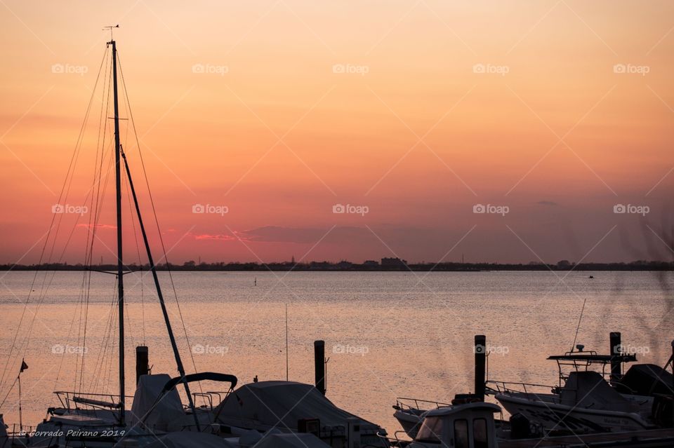 sunset through a see port
