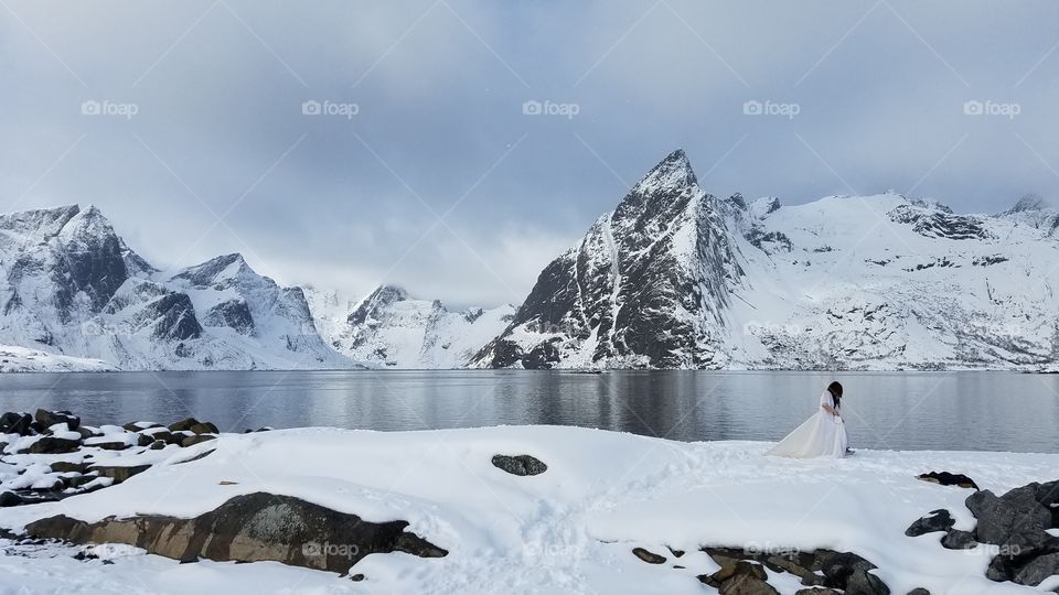 Girl in a white dress on the winter day