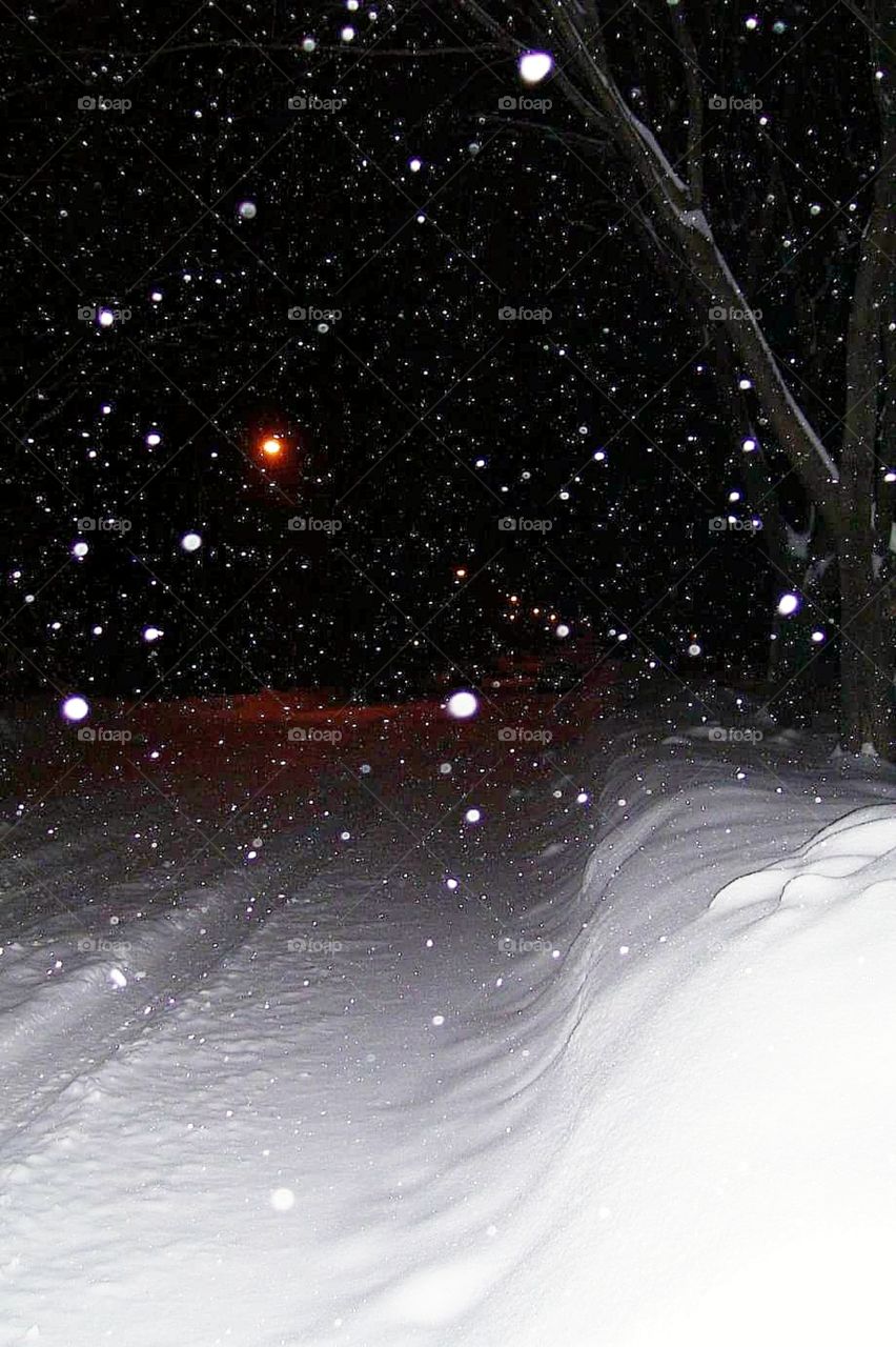 Street light shining in snow