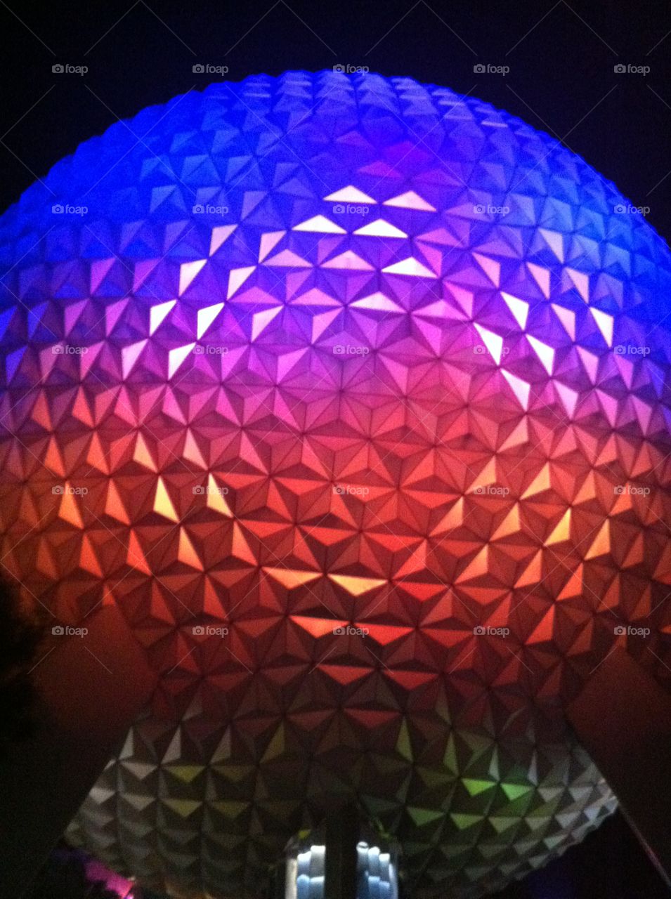 Big golf ball colorful ball blue and red color Epcot Diane world Florida night time light pleasant night