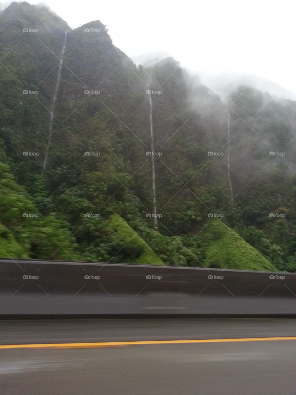 Waterfalls. waterfalls cause by lots of rain on Oahu.