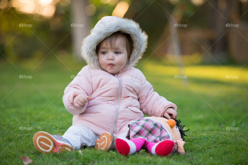 cute baby in pink coat