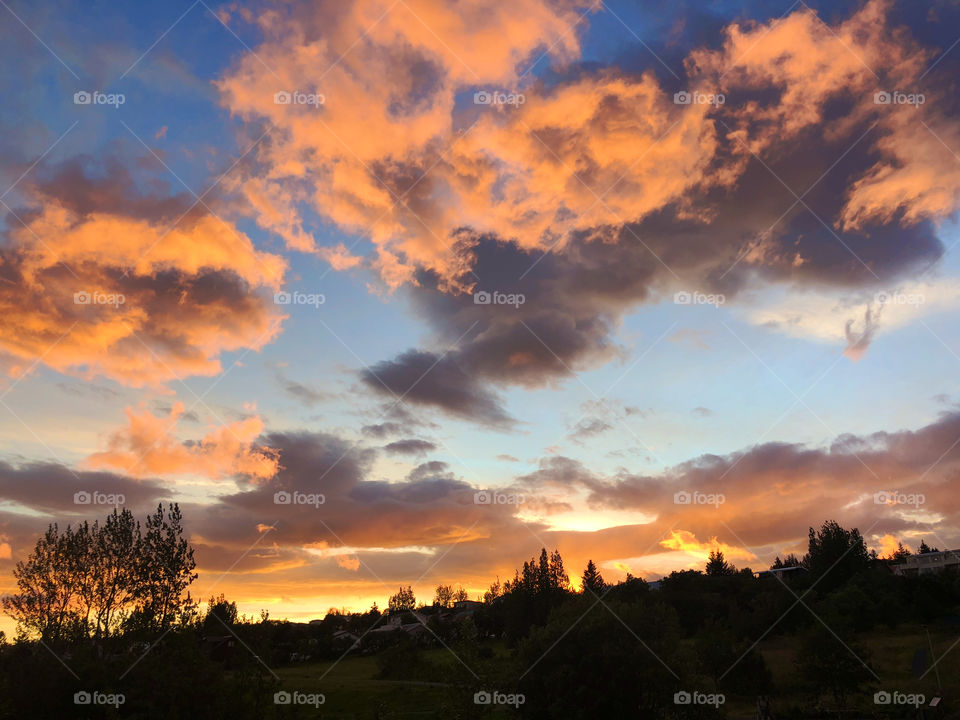 Looked like the clouds were set afire with the suns fading rays. The sight frozen me in the moment which is funny for the beauty was on fire!