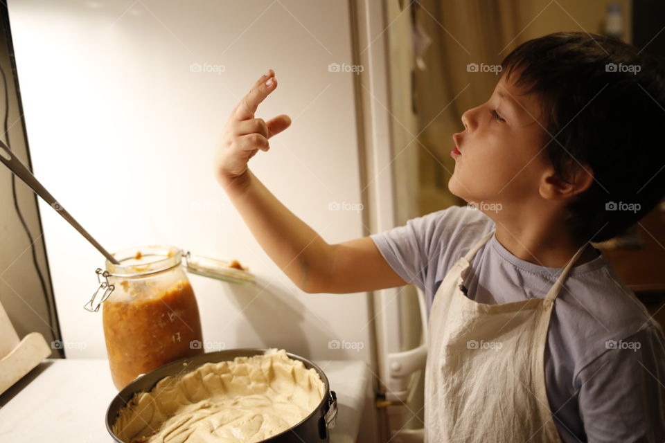 boy having fun while cooking