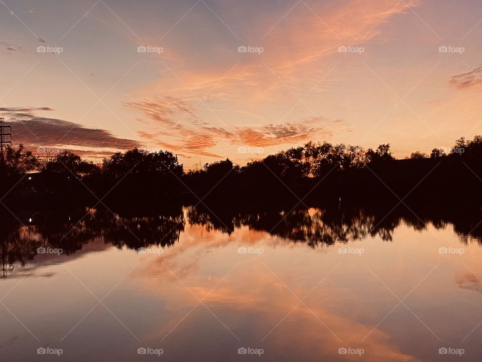 Twilight in the ending stage as the colours begins to paint the night sky. High clouds align with the Reflections of top lake water. Seems like something is missing from the normal blast of night colours.