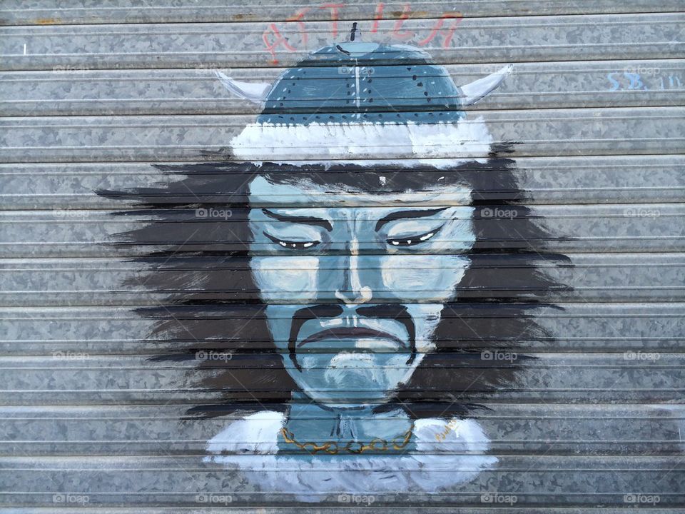 Gengis Khan graffiti on a metal shutter