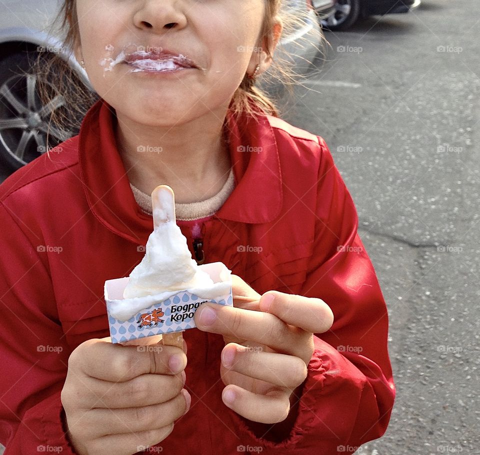 Girl Eating Ice Cream. She got her face dirty, but still happy and smiling