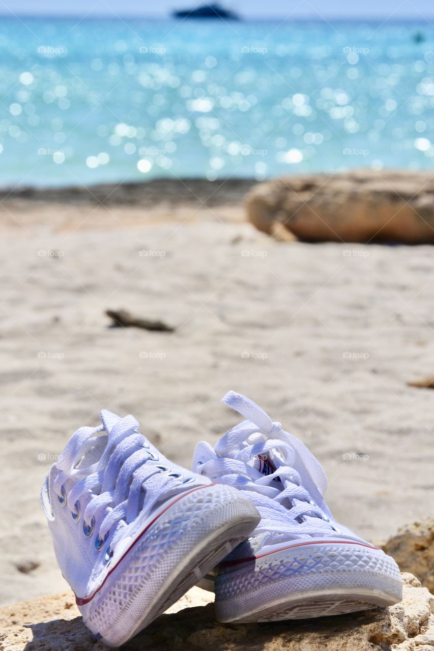 Converse on the beach