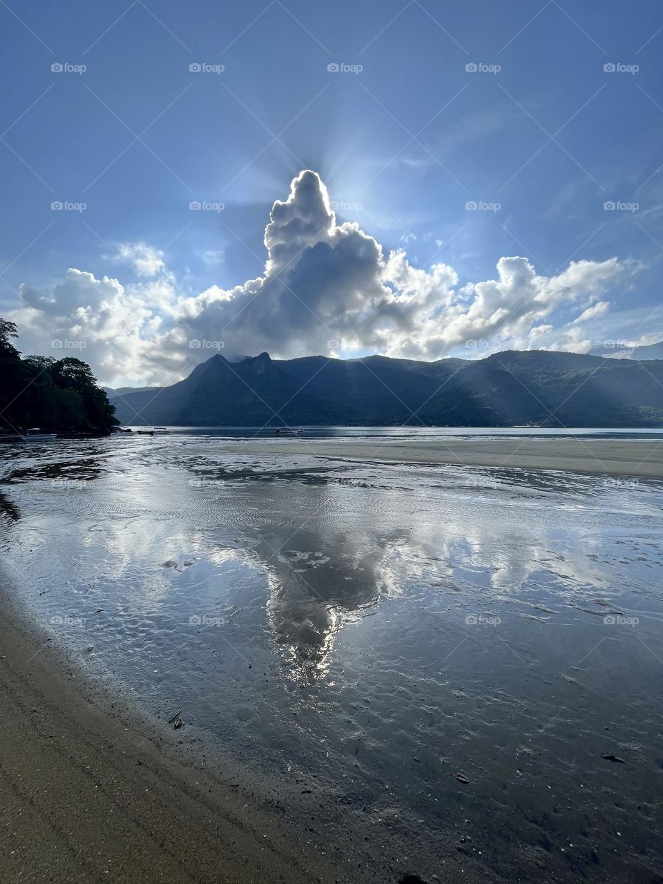 A “cloudberg” in the sky. Every day in Saco do Mamanguá - RJ, Brazil is different, but all days are perfect, beautiful and peaceful. 