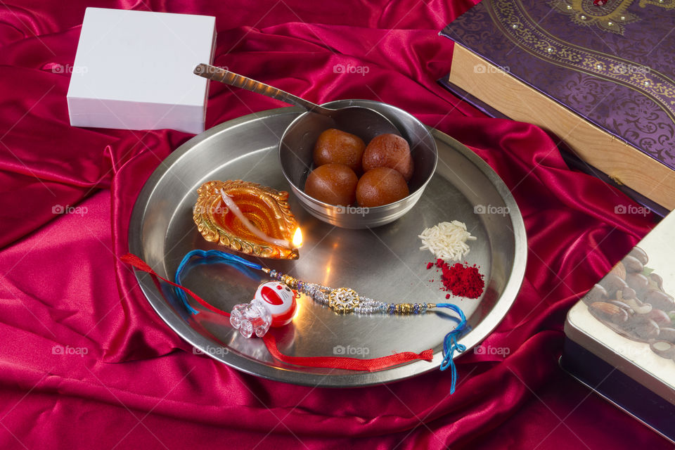 Indian festival Raksha Bandhan thali with rakhi and sweets