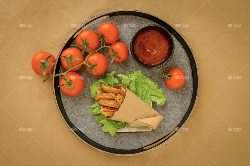 fried homemade potato with tomato ketchup