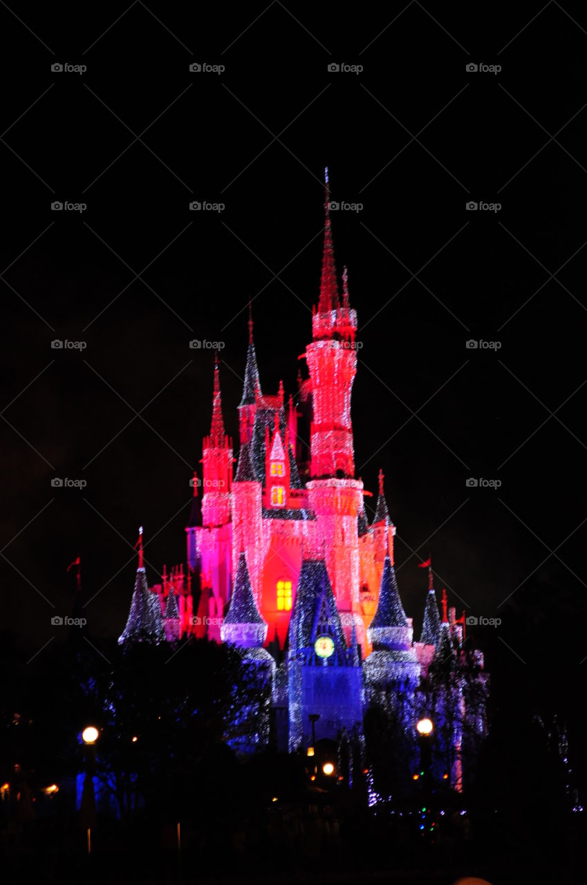 Cinderella's castle at night. This is one of the lighted images of Cinderella's castle at night at Disney's Magic Kingdom in Orlando Florida